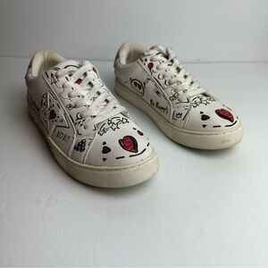 White Sneakers with Red Heart Design
